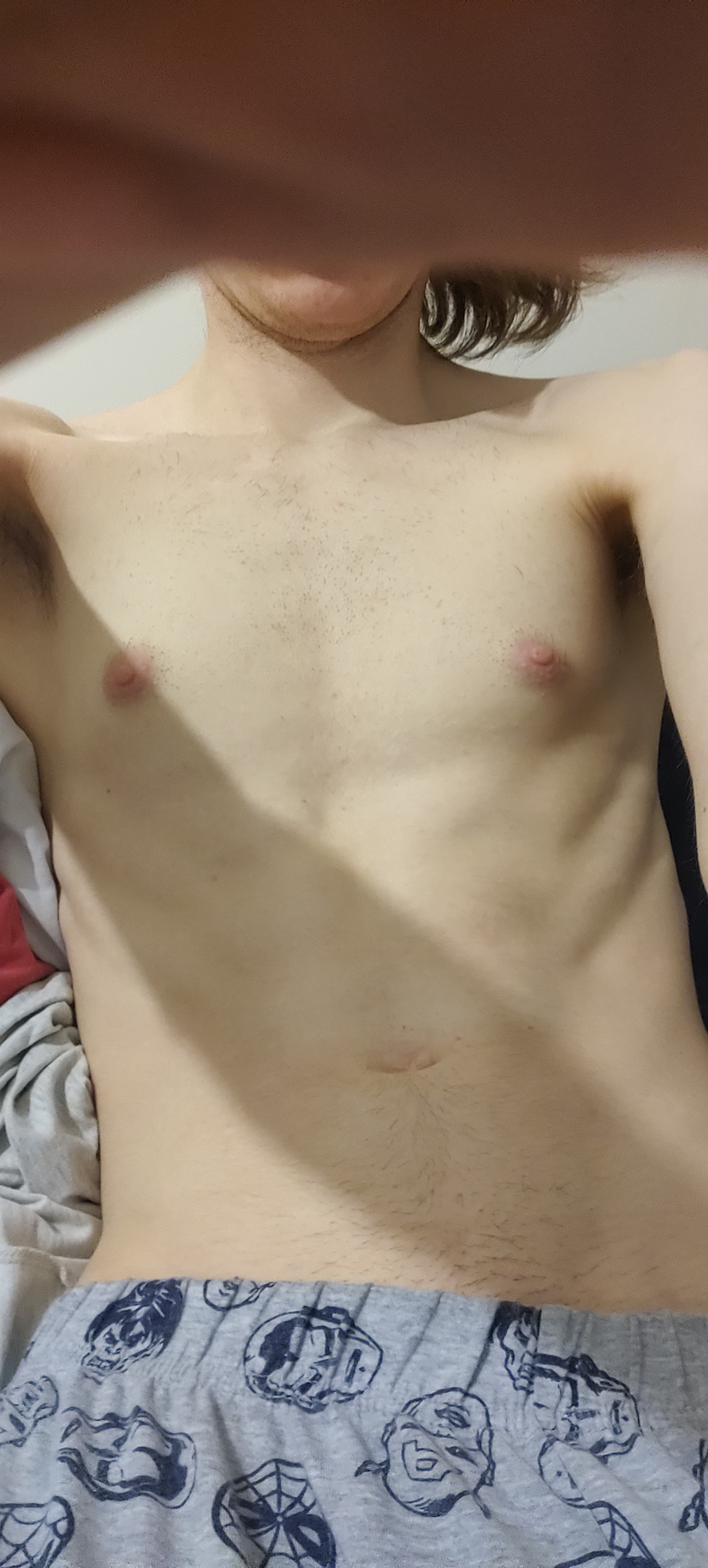 A mildly toned tummie of a pasty white enby