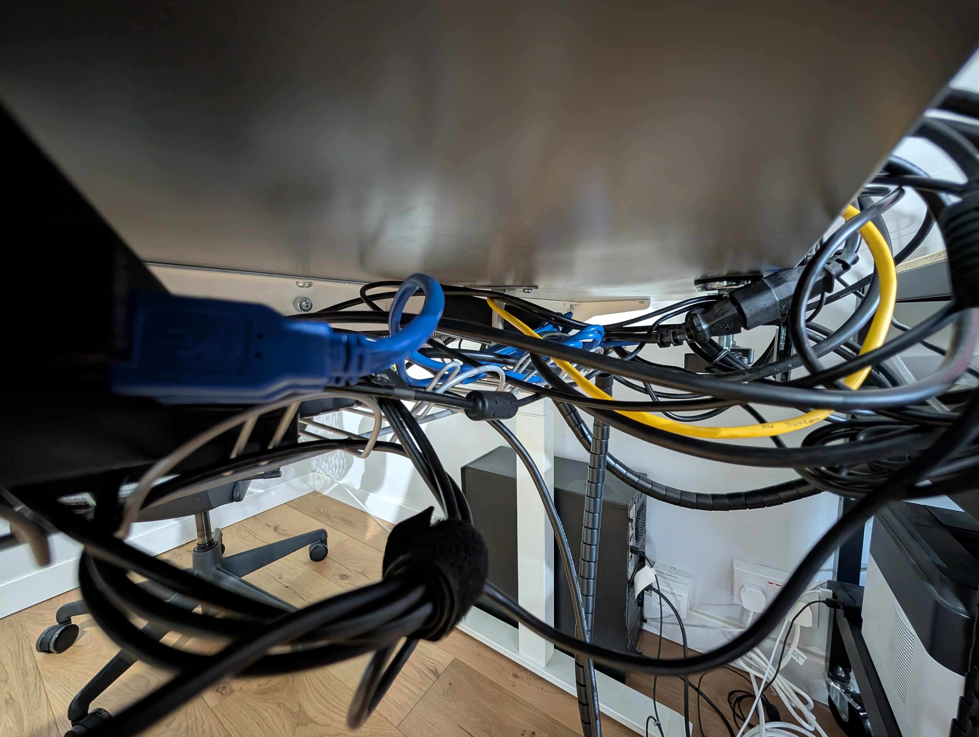Looking under the desk. You can see the desktop in the corner.
There's a lot of messy cables. Looking under the desk. You can see the desktop in the corner.
There's a lot of messy cables.