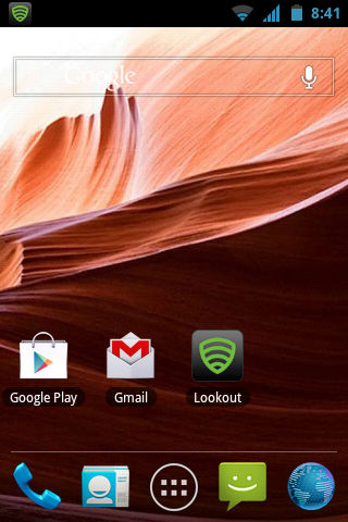 home screen, a fresh installation with default icons (except for lookout antivirus) and a default wallpaper. icons on dock: phone, contacts, app drawer, messaging, internet. right above, there's google play, gmail and lookout