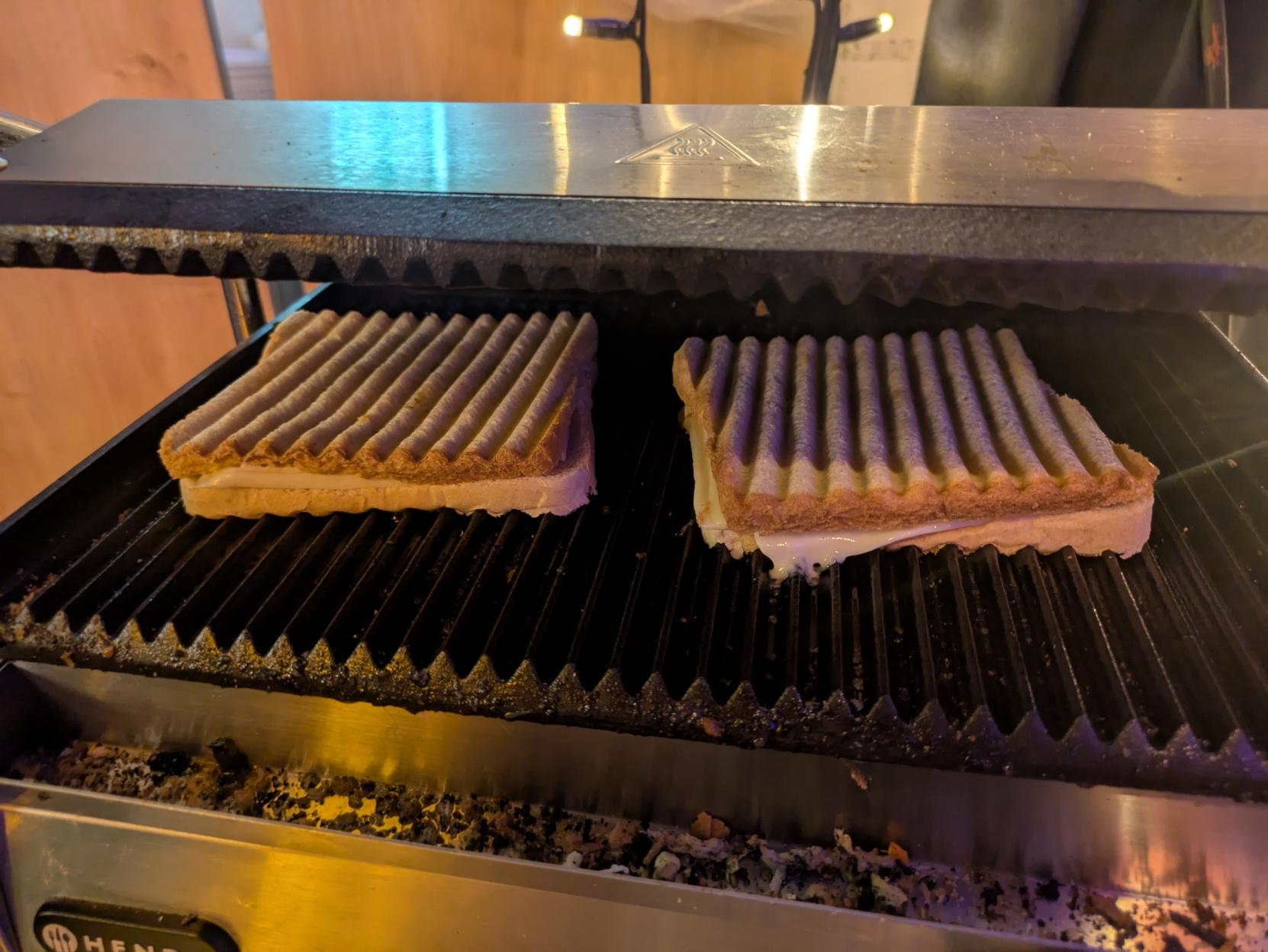 two cheese sandwiches in a contact grill