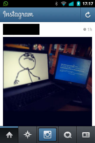 screenshot on my samsung galaxy ace running a custom rom. the instagram app (anno 2013) is open. it shows a photo i posted (name and avatar redacted) of two laptops. one shows a bluescreen, the other an old black-on-white drawn meme stick figure, seemingly looking down on the bluescreened laptop