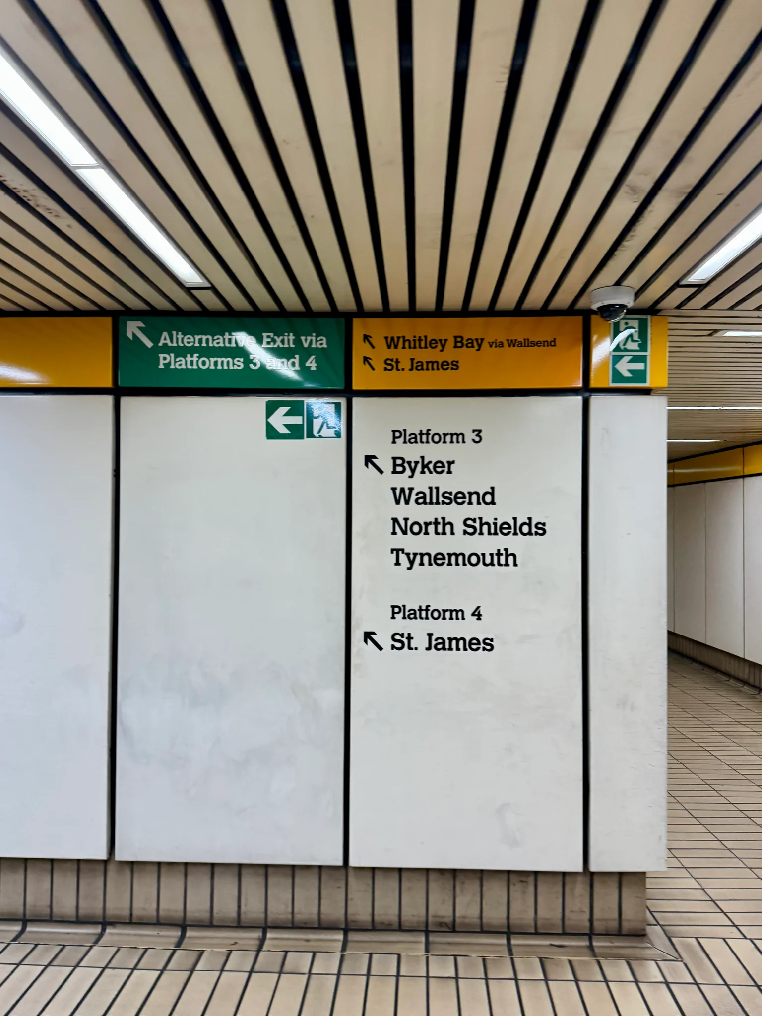 A busy sign in the typeface, with destination information, emergency exit info, and local info.