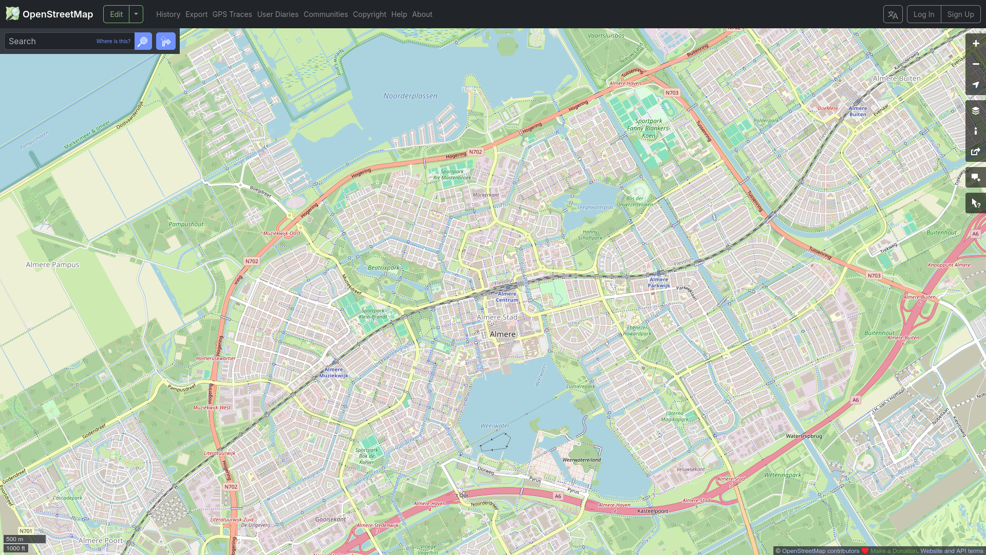 railway line going straight through dense urban area in Almere, the Netherlands. With Almere Cenrum being literally in the middle of a dense city center